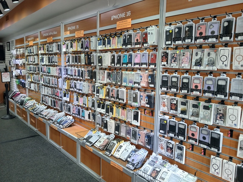 Inside Cellular Toy Shoppe — accessory wall and showroom